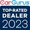 Badge with CarGurus logo at the top, featuring red and blue text. Below, a dark blue square contains the words Top-Rated Dealer 2023 in white, indicating an award or recognition for car dealerships.