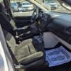 The 2017 Dodge Grand Caravan SE interior highlights its seats, steering wheel, and dashboard. Floor mats show shoe prints and a thank you message. Vehicles are visible through the windows.